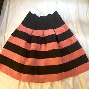 Cute! Peach and Black Skirt. 4” above knee length.